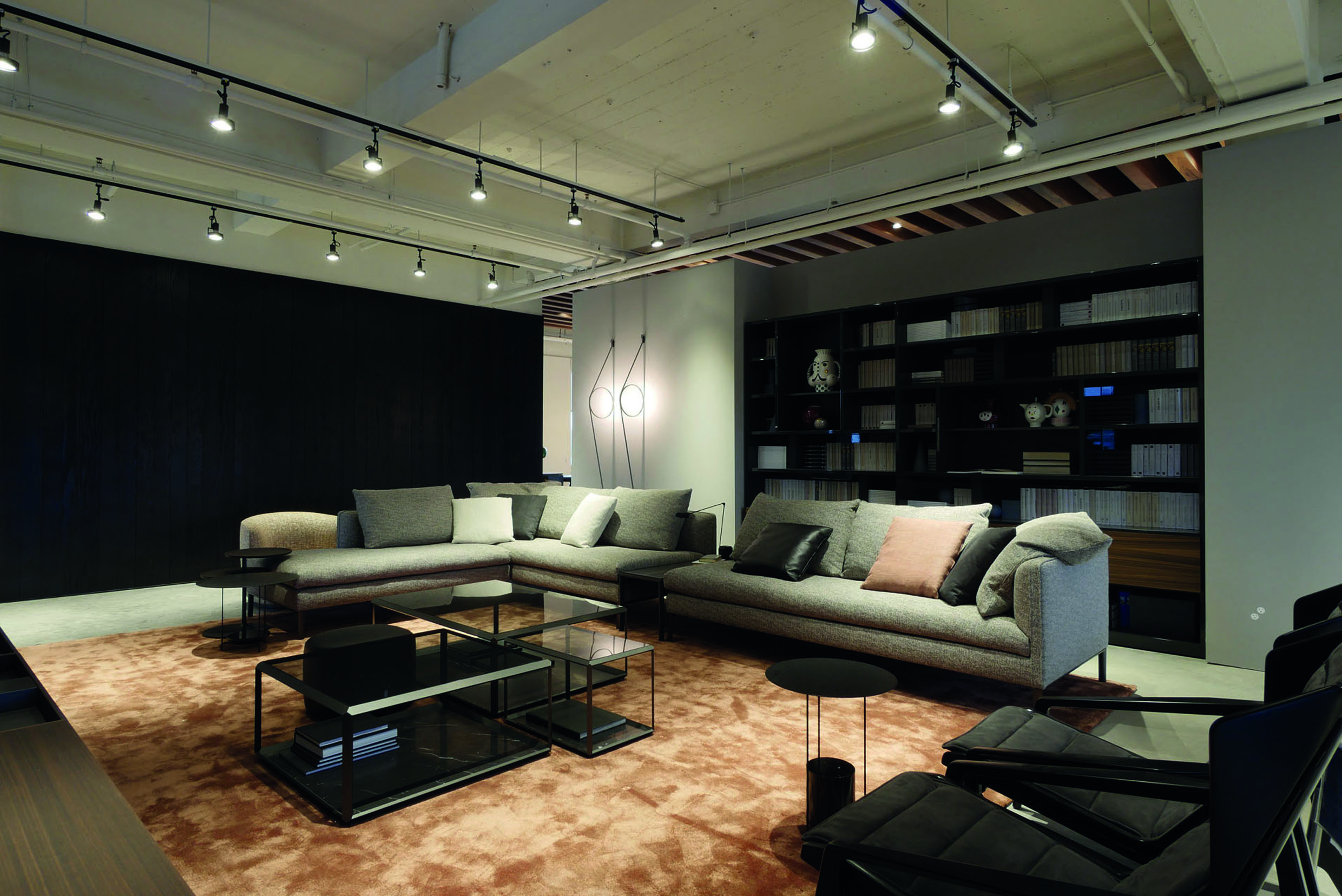 Design Living room with light colored Sofa and Black armchairs 